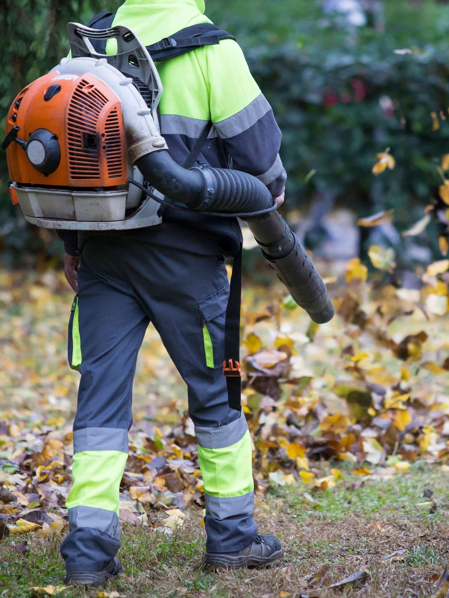 grounds maintenance in Birmingham - man with blower blowing leaves